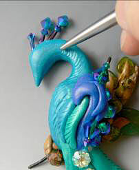 Clay peacock being textured